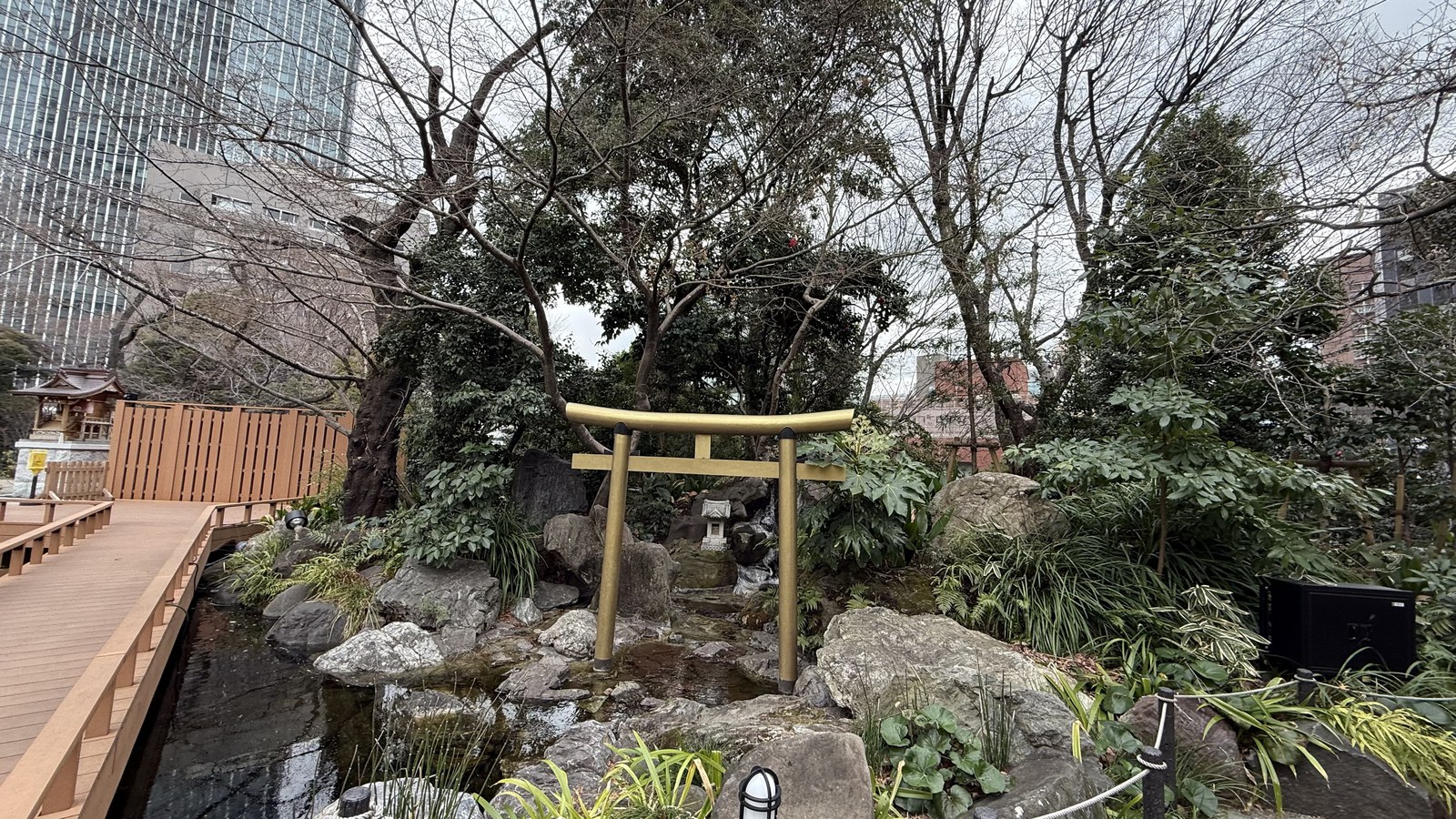 The grounds' garden, with high-rises crowding in behind it