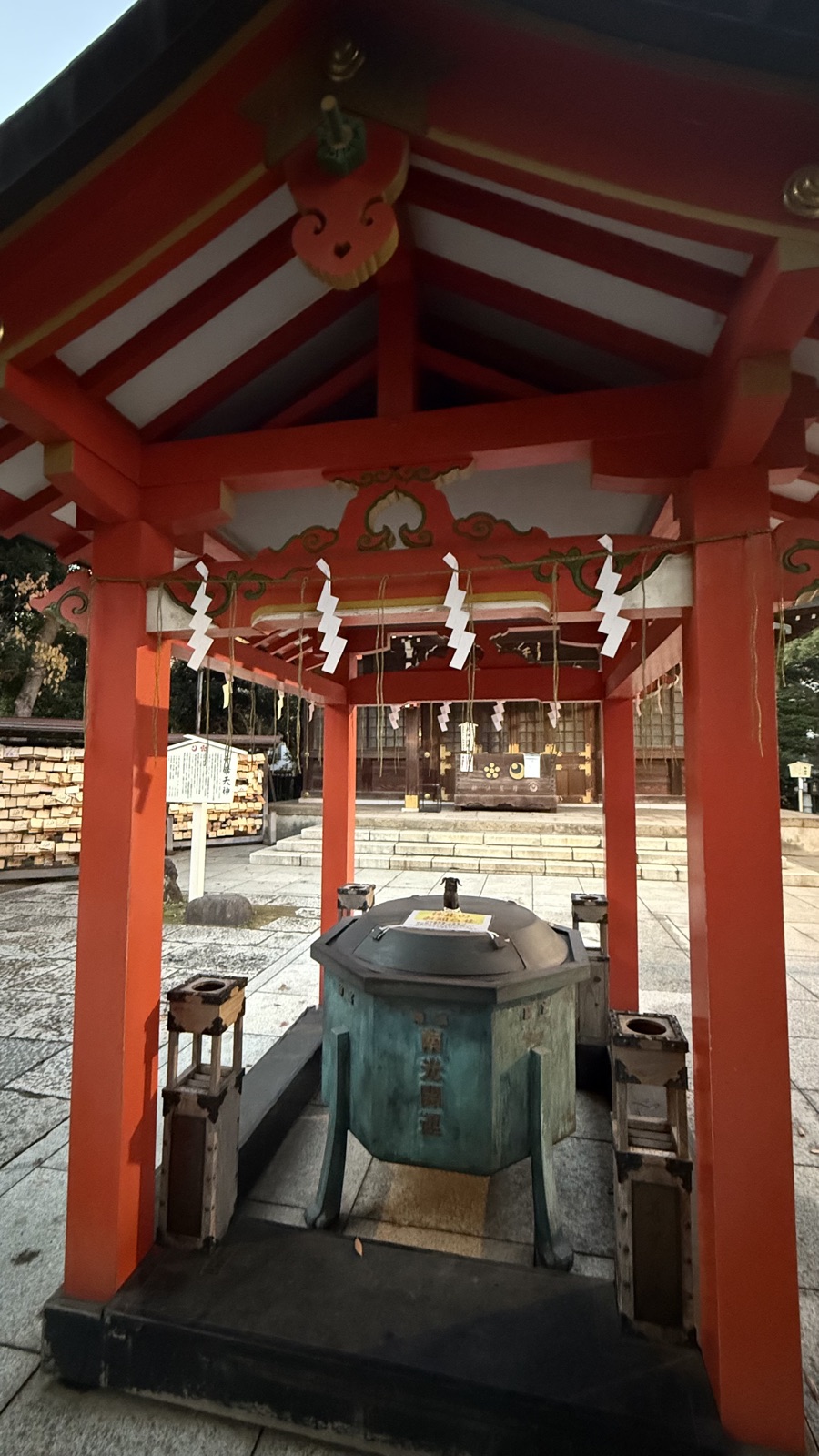 Incense burner under a vermilion shelter