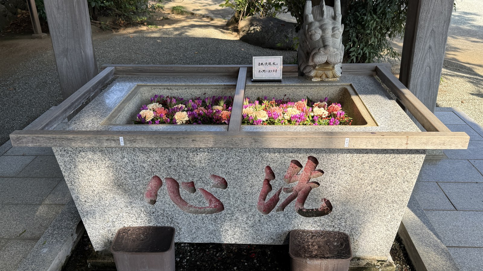 The water basin with floating flowers