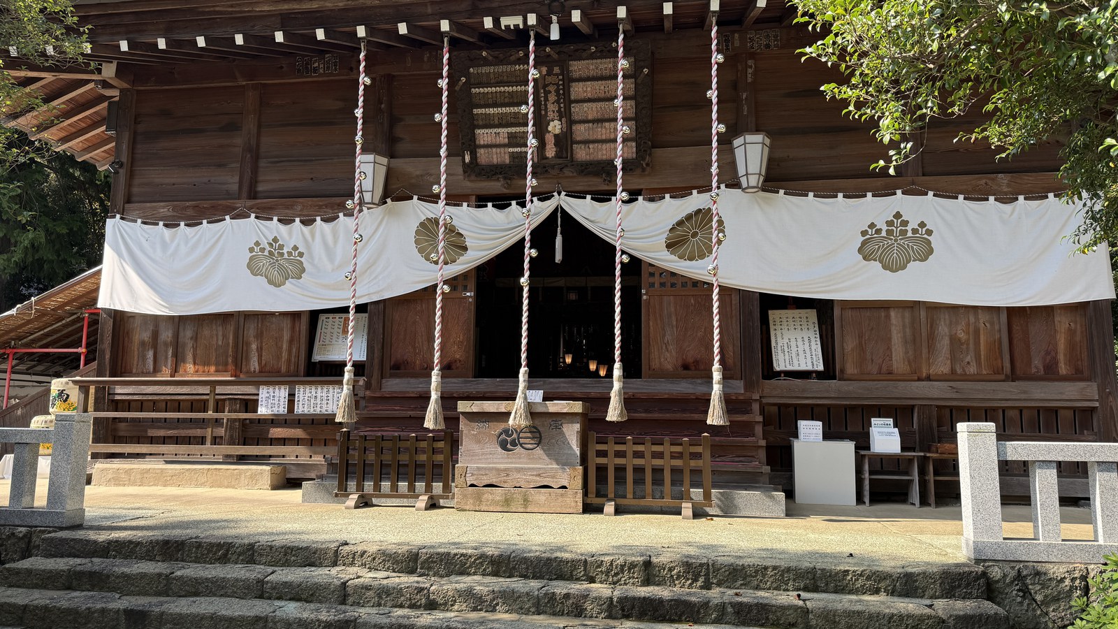 The front of the main hall, with its bell ropes and crest curtain