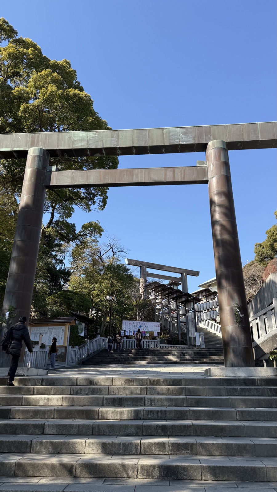 Stone steps and a large torii leading uphill