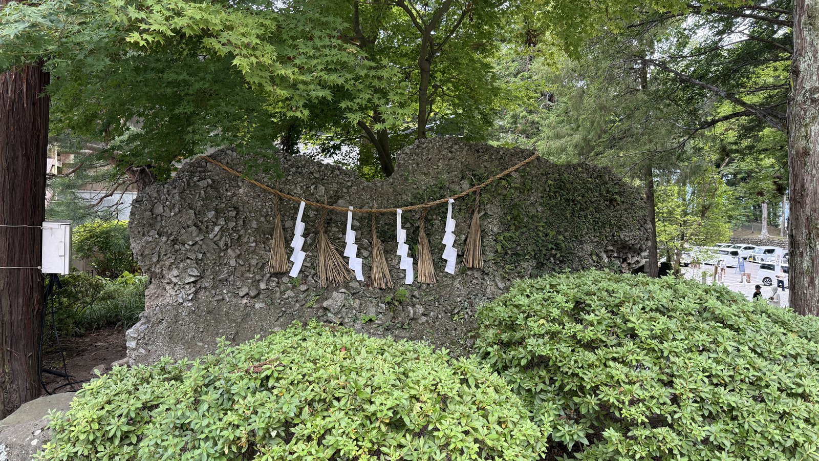 A large rock with a shimenawa