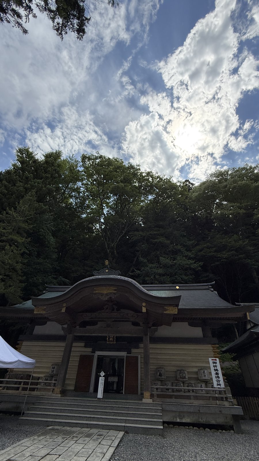 The front of a building with a curved roof