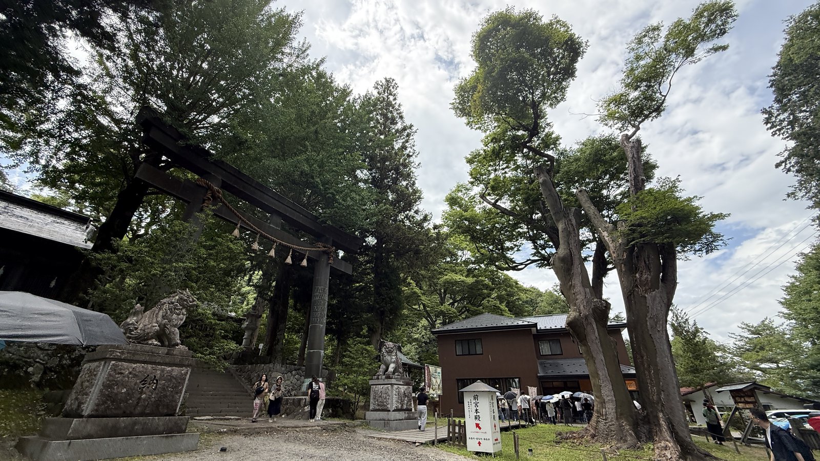 The wooden torii and komainu of Maemiya