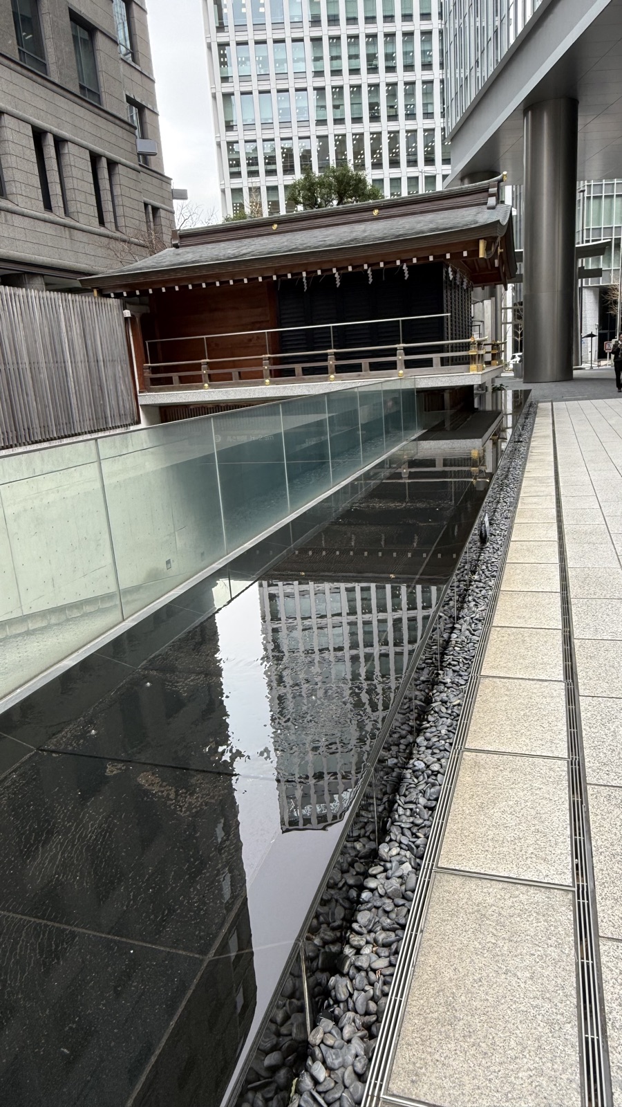 Shrine building over an artificial pond